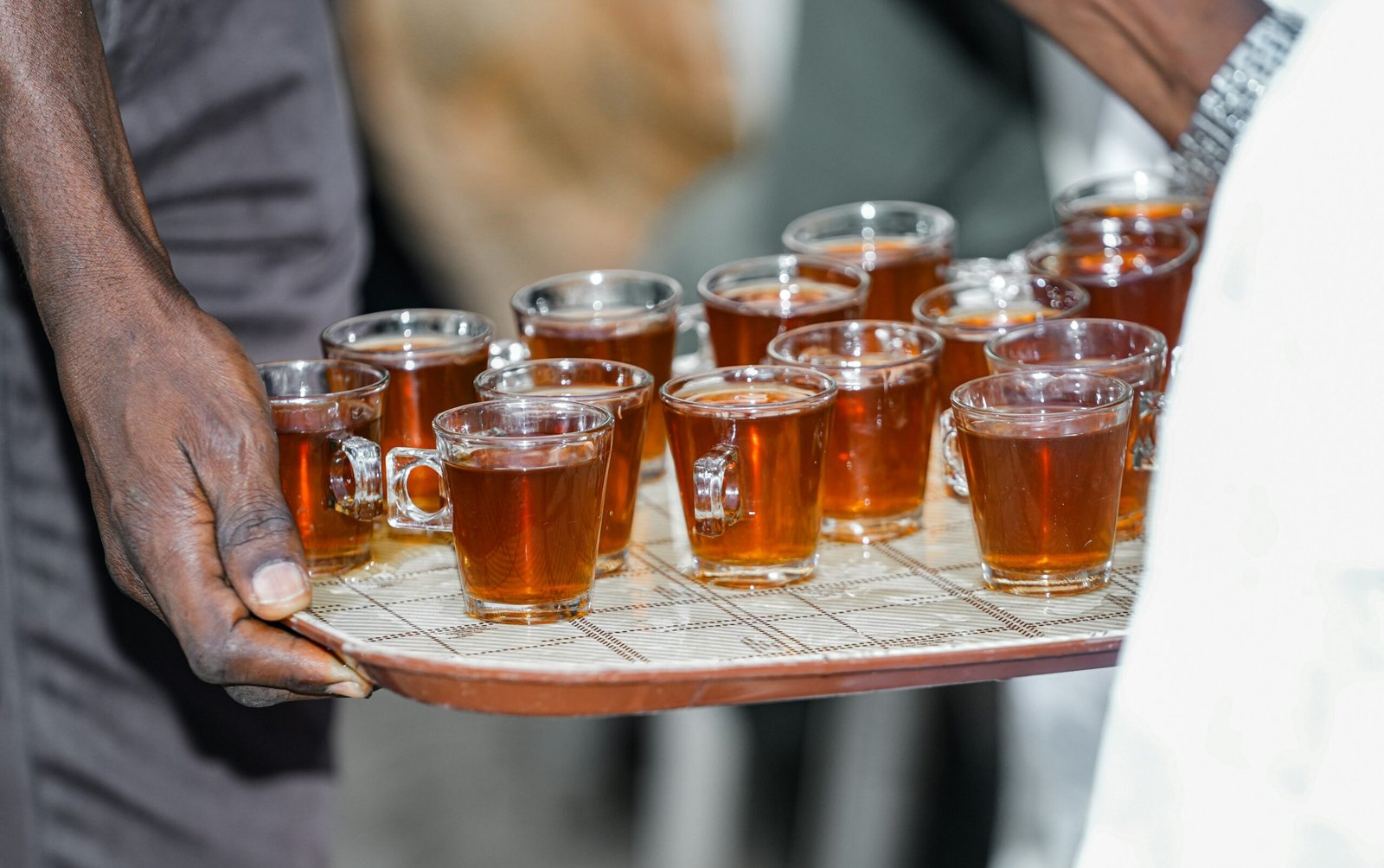 A tray full of beer glasses on a tray